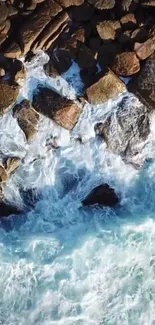 Aerial view of rocky coastline with crashing ocean waves.