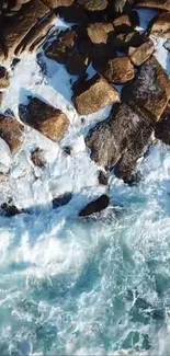 Aerial view of ocean waves crashing onto rugged rocky shoreline.