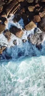 Aerial view of waves crashing against rocky shore.