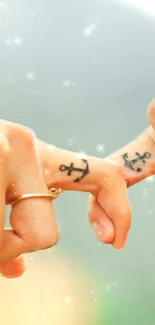 Fingers with anchor tattoos and soft sparkles in a serene setting.