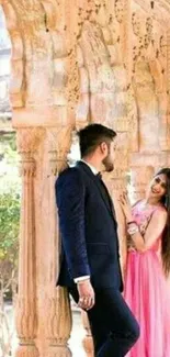 Couple in love standing under ornate archways.