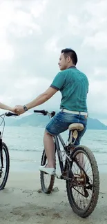 A couple cycling along a scenic beach.