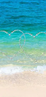 Two hearts over a serene beach with blue ocean.