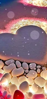 Romantic beach heart with glowing stones in pink hues.