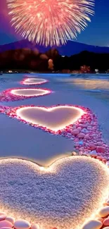 Hearts on a beach with fireworks overhead.