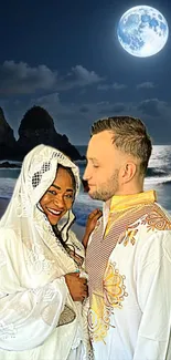 Couple in traditional attire under a full moon on a beach.