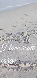 Beach with love message written in sand.