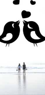 Silhouette of birds and couple on beach with hearts.