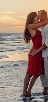 A couple shares a romantic kiss on the beach during a beautiful sunset.