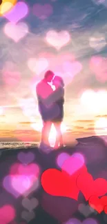 Couple embracing at sunset with heart bokeh overlay on a beach.