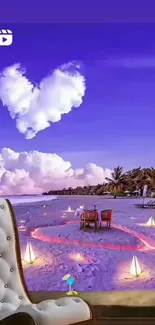 Romantic beach with heart-shaped cloud at sunset.