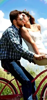 Couple on a bicycle in a sunny countryside setting.