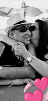 Romantic couple in black and white with pink hearts.