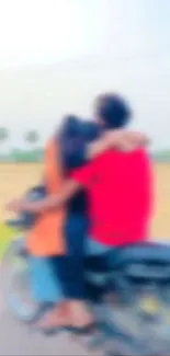 Blurry image of couple on motorcycle in scenic landscape.