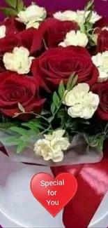 Romantic bouquet of red and white roses with a special gift box.