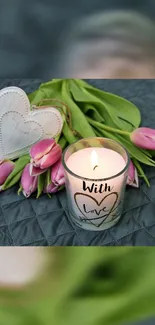 Romantic candle and tulips on gray background, perfect for calming wallpaper.