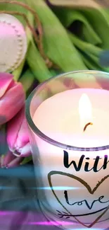 Romantic candle with heart design and pink tulips.