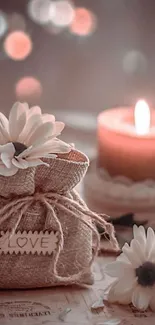 Romantic burlap sack with candle and daisies.