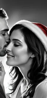 Romantic couple under mistletoe with Santa hat, in grayscale theme.