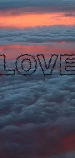 LOVE text on clouds with a sunset sky