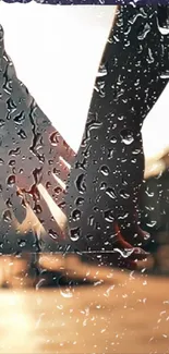 Couple holding hands through rainy window, creating a romantic ambiance.