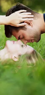 Romantic couple lying on green grass.