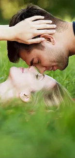 Romantic couple lying in green grass.