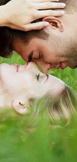 Romantic couple gently embracing on lush green grass.