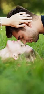 Romantic couple lying in lush green grass.