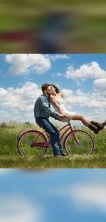 Romantic couple on bicycle under a clear blue sky in a green field.