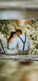 A romantic couple sits on wooden deck under trees, bathed in soft sunlight.