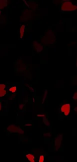 Romantic dark wallpaper with scattered red hearts.