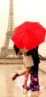 Couple in Paris kissing under a red umbrella by the Eiffel Tower.