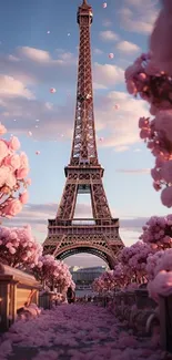 Eiffel Tower framed by pink blossoms at sunset.