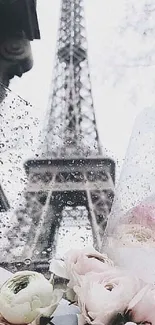 Romantic Eiffel Tower with flowers and soft pink hues.