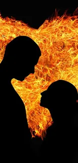 Silhouette couple with fiery heart background, radiating romance and passion.