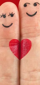 Two fingers with smiles and a heart between them on a red background.