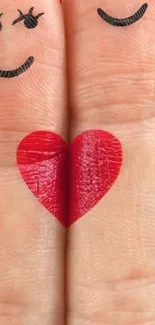 Creative finger heart art with playful faces on red background.