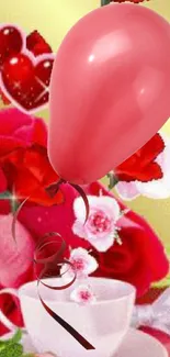 Pink balloon with red roses and teacup flowers in vibrant wallpaper.