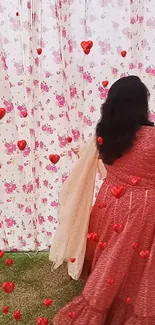 Woman in a red gown under floral curtains with floating hearts.