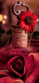 Burgundy red rose with twine spool and floral accents.