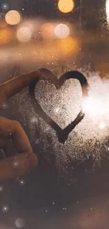 Heart drawn on foggy window with bokeh lights.