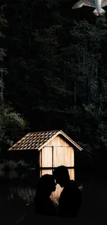 Romantic couple by a lake cabin at night under a forest sky.