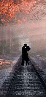 Romantic embrace on forest railway at sunset.