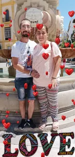 Couple by fountain with red hearts and LOVE text design.