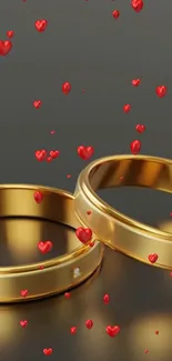 Gold rings with red hearts mobile wallpaper, perfect for a romantic theme.