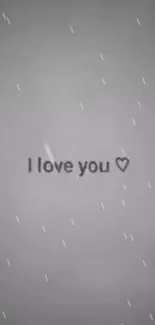 Grey wallpaper with 'I love you' text and heart symbol.