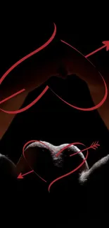 Romantic hands forming a heart with red arrows on dark background.