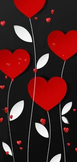 Mobile wallpaper with red hearts on black background.