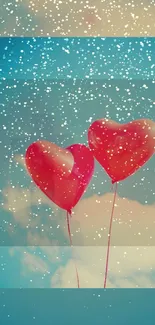 Romantic heart balloons float in a snowy sky.